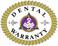 The image displays a graphic logo with text elements. At the top, there s a circular emblem featuring an intertwined snake and staff symbolizing medicine or healthcare, inside of which is a shield with the letters  DENTAL  prominently displayed in capital letters. Below this emblem, the word  WARRANTY  is written in all caps, followed by the phrase  CORP. COM  indicating a corporate website address. The background of the logo is white with a gold border and a purple ribbon across the top.