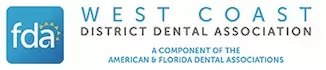 The image displays a logo with text, which includes the name  West Coast District Dental Association,  a website address, and a phone number. The logo features a stylized representation of a dental implant, along with other design elements.