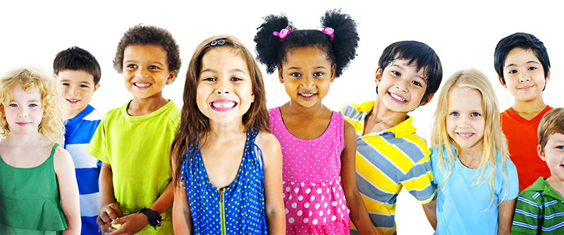 The image features a diverse group of children smiling at the camera, with each child wearing a different colored top.